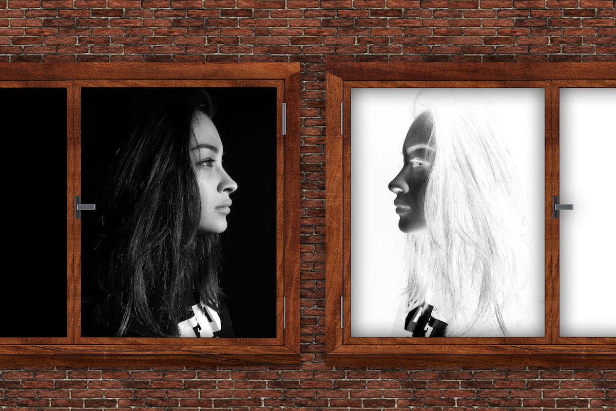 Image of a woman staring at a negative image of herself