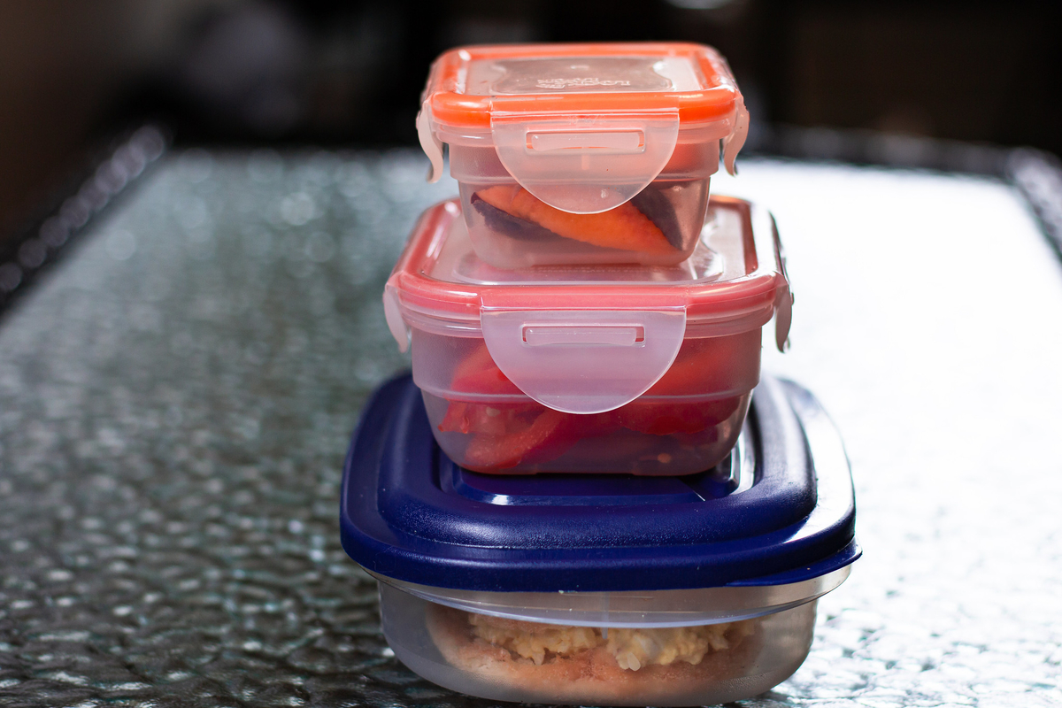 Three food containers stacked on top of each other.
