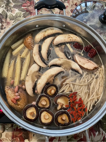 A bowl of mushrooms and other vegetables