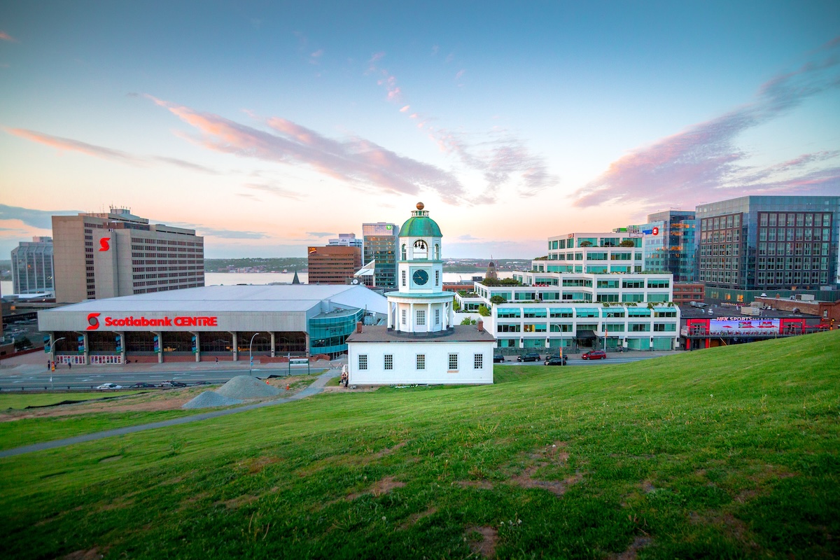Halifax town clock with downtown skyline behind it
